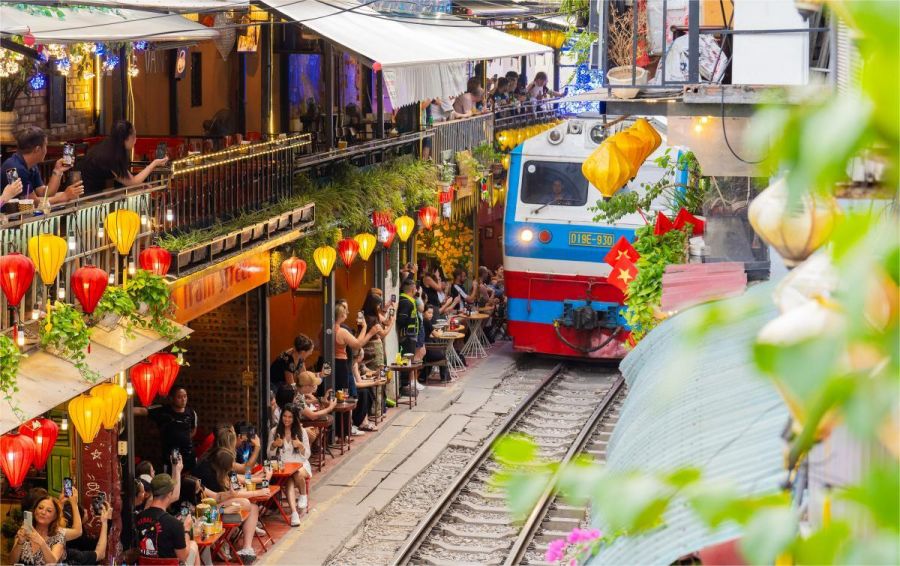 Watch The Train Pass On Hanoi Train Street