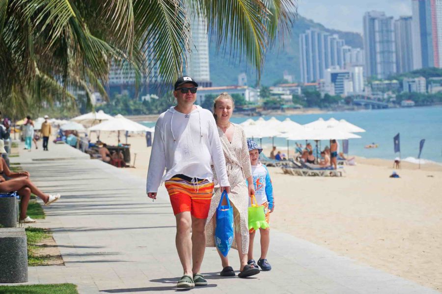 ourists walk on Nha Trang beach