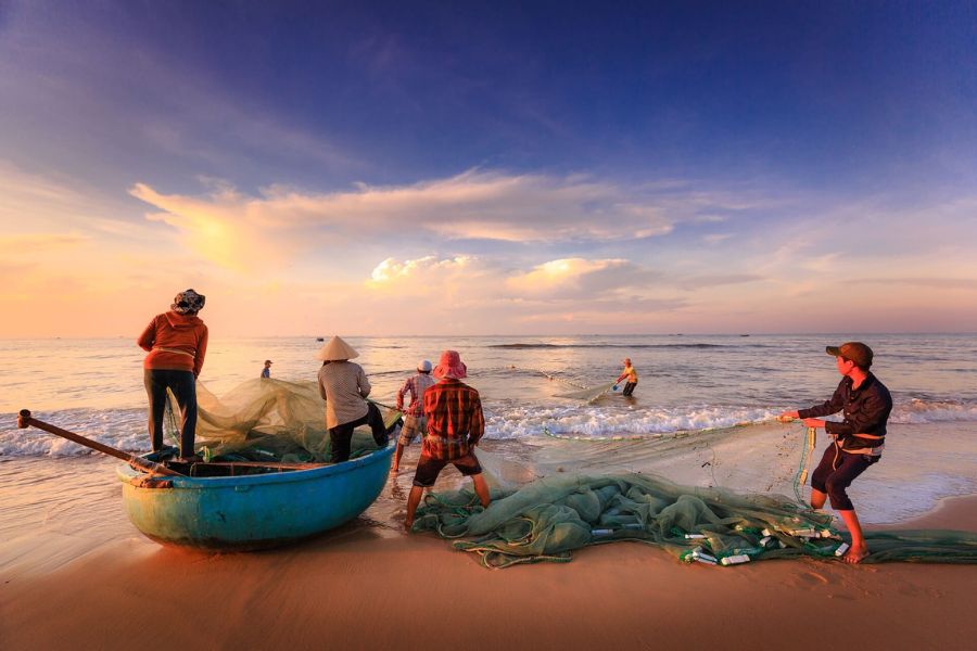 Visiting the fishing village near Nam O Beach