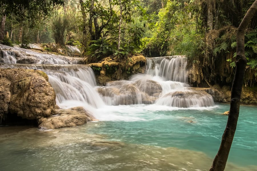 Kuang Si Waterfalls is a spectacular multi-tiered waterfall