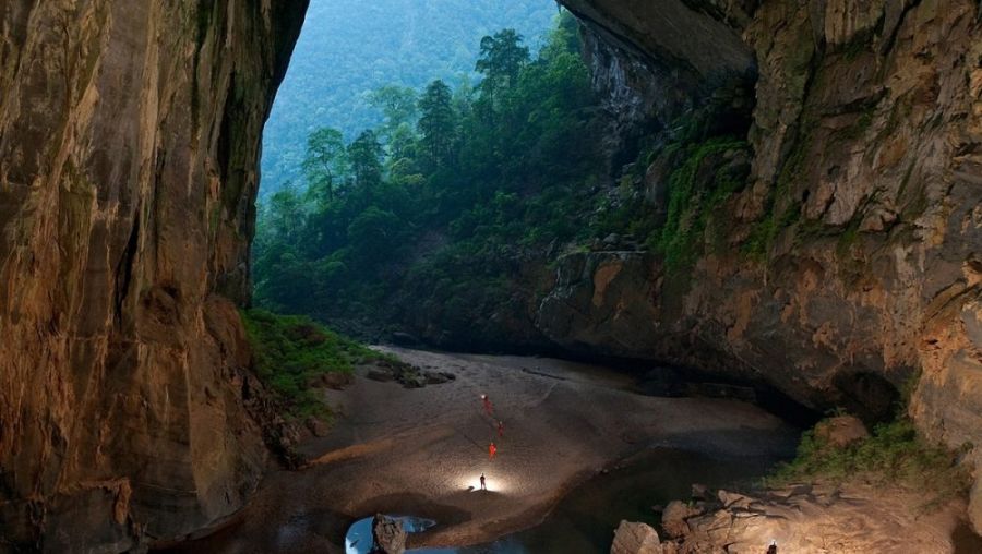 Trekking Through The Dense Jungle To Reach The Cave