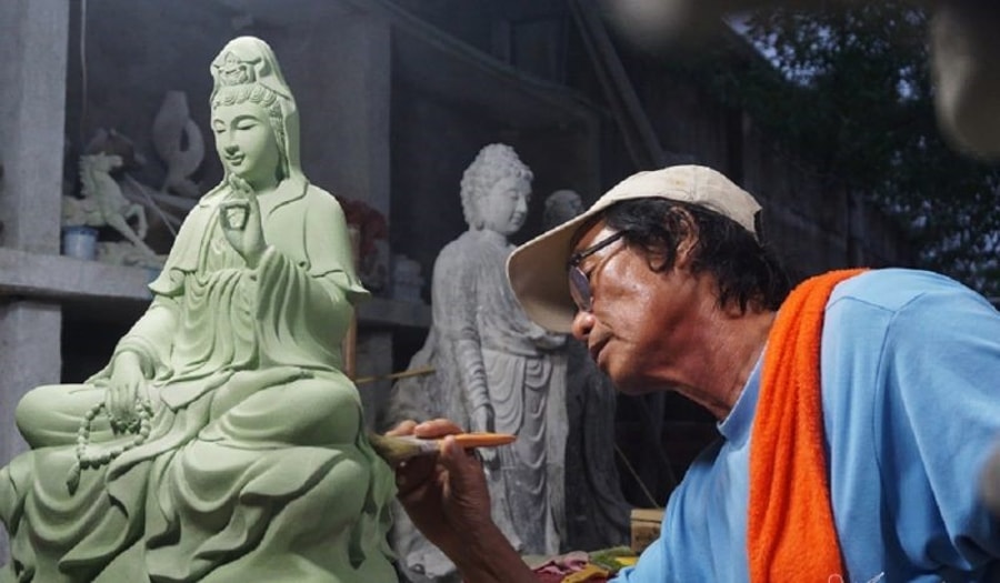 local craftsmanship creating statue