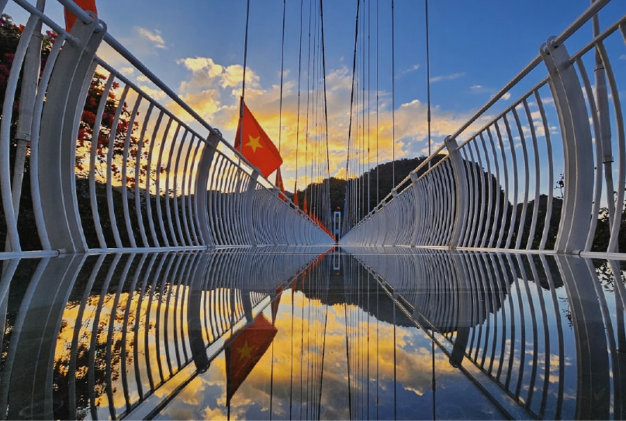 sunset in the Bach Long Glass Bridge 