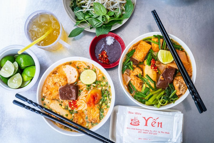 Bun Rieu dish is garnished with chopped scallions